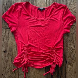 Bright red baby tee.